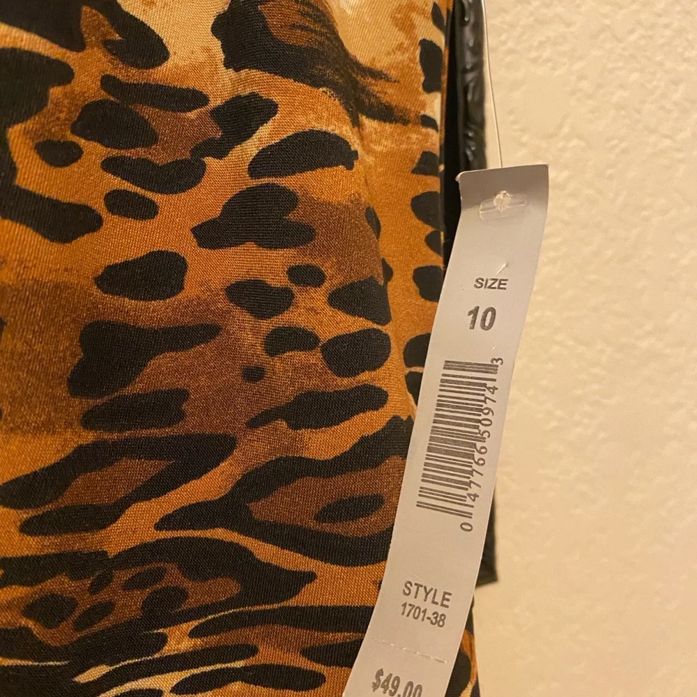 Animal print dress with gold grommets around neckline. Size 10, back zipper. NWT - Picture 3 of 4